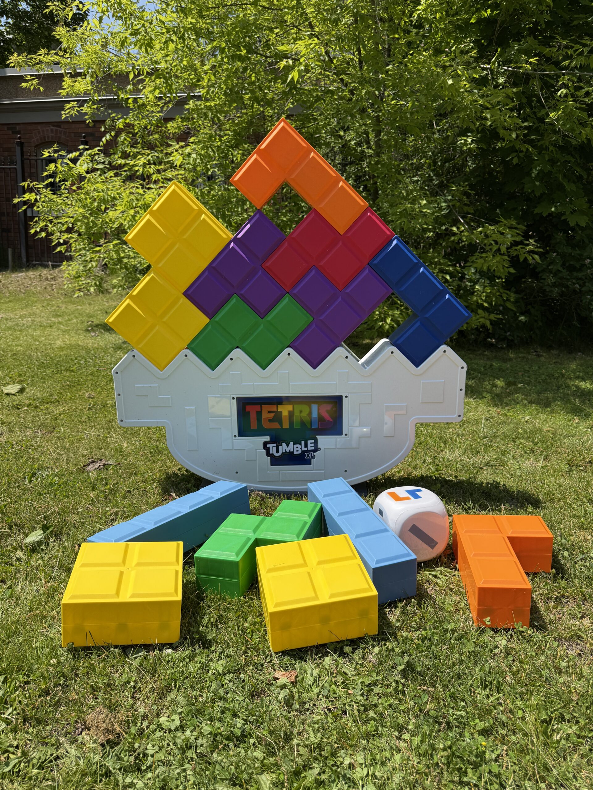 Jumbo Tetris Tumble game sitting on grass outside